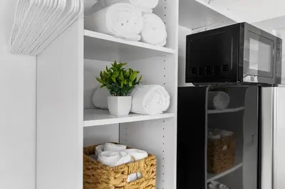 a kitchen with a refrigerator and a microwave at Sun Getaway Rentals in Fort Lauderdale