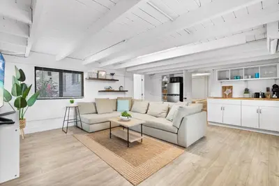 a living room with a couch and a table at Sun Getaway Rentals in Fort Lauderdale
