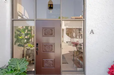 a door in a building with a window at Villa at St James Unit A Luxury Pool Villa, Pet Friendly in Miami