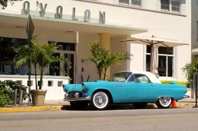 a blue car parked in front of a building at Huge 1 bed newly renovated free parking in Miami