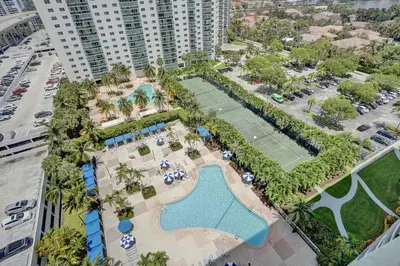 an aerial view of a tennis court and a tennis court at Ocean Reserve Condominium in Miami Beach