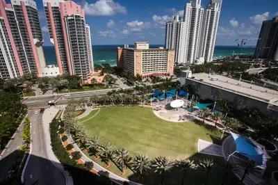 an aerial view of a city with tall buildings and a park at Ocean Reserve Condominium in Miami Beach