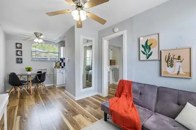 a living room with a couch and a table at Seascape - Mins to Las Olas & Beach in Fort Lauderdale