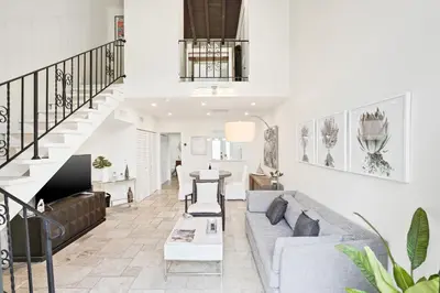 a living room with a couch and a table at Luxury Pool Villa at St. James UNIT E, Pet Friendly in Miami
