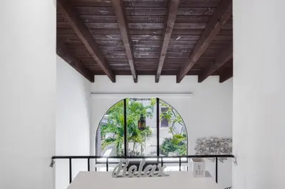 a dining room with a table and a window at Luxury Pool Villa at St. James UNIT E, Pet Friendly in Miami
