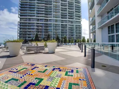 a quilt table on a balcony of a building at ICON W BRICKELL BY IMD MIAMI Elegant River View 1BR 1BA in Miami