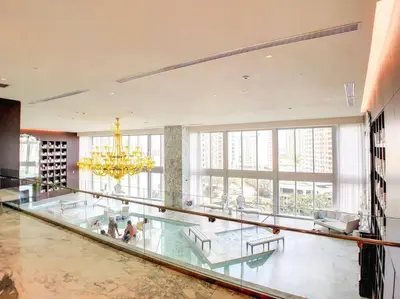 a large room with a glass floor and a chandelier at ICON W BRICKELL BY IMD MIAMI Marvelous Ocean View 2BR/2BA in Miami