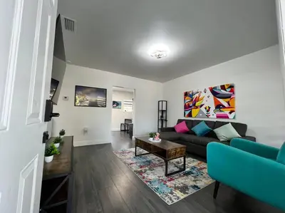 a living room with a couch and a table at Stylish 2/1 centrally located! in Miami
