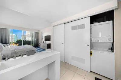 a white bathroom with a bed and a sink at W FT LAUDERDALE RESIDENCES BY IMD MIAMI Stunning 2BR/2BA Unit in Fort Lauderdale