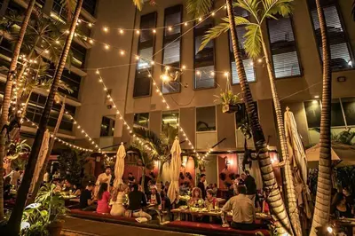 a group of people sitting in a building with lights at BOULAN HOTEL MIAMI BEACH BY IMD MIAMI 1BR/1BA UNIT in Miami Beach