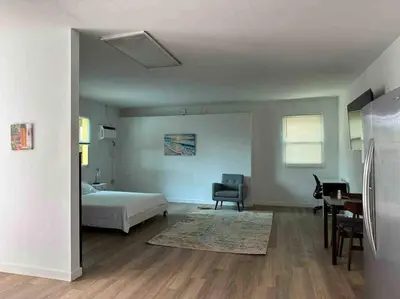 a bedroom with a bed and a chair and a desk at Stylish StudioBrickellLittle Havana-ItalianPlaza in Miami
