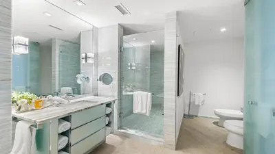 a bathroom with a shower and a sink and a toilet at 2B Ocean View Private Residence at South Beach - 804 in Miami Beach