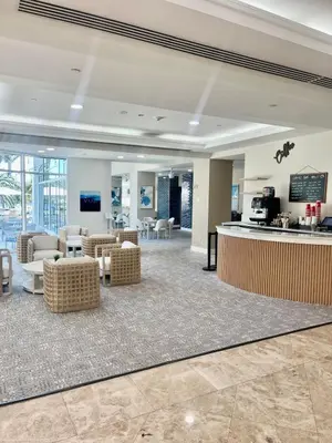 a lobby with a waiting area with couches and chairs at Condo, Breathtaking Water views, King Suite, Hilton Property in Fort Lauderdale