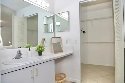 a bathroom with a sink and a mirror at Charming 2 bedroom 2 bathrooms at aventura in Miami
