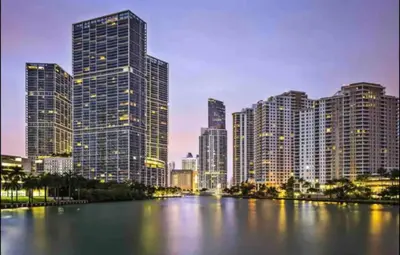 a city skyline with tall buildings and a river at LOVELY 2 BR W ICON BRICKELL-WATERVIEWS -FREE SPA in Miami
