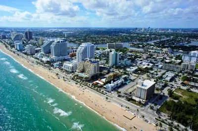 an aerial view of a beach with buildings and the ocean at Fort Lauderdale Beach Resort by Vacatia in Fort Lauderdale