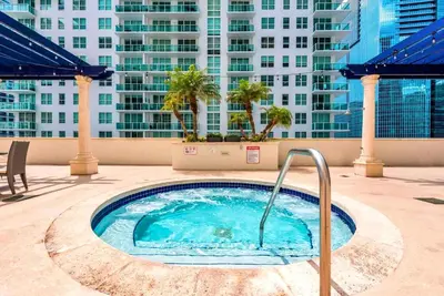 a hot tub on the roof of a building at Condo with Panoramic City Views in Brickell in Miami