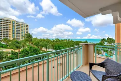 a balcony with chairs and a view of the ocean at Stylish Suite to Have a Great Stay! in Miami
