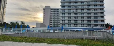 a large building in front of a building at Departamento con salida al mar Miami in Sunny Isles Beach