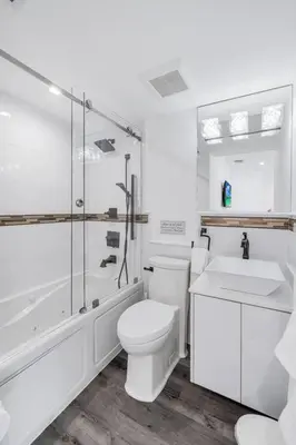 a bathroom with a toilet and a shower and a sink at Homey Studio near the Airport and Water Park in Miami