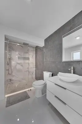 a bathroom with a shower and a toilet and a sink at Mykonos Home - 2 2 Cozy and Charming Duplex in Miami