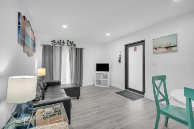a living room with a couch and a table at West Brickell APT #1 Free Parking-Family Friendly in Miami