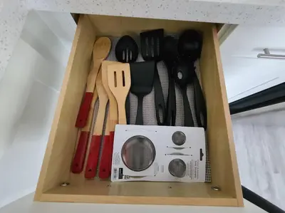 a wooden drawer with utensils in a box at West Brickell APT #1 Free Parking-Family Friendly in Miami