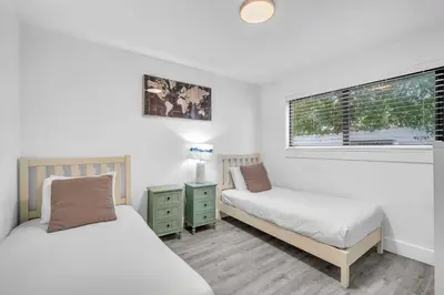 a bedroom with two beds and a window at West Brickell APT #1 Free Parking-Family Friendly in Miami