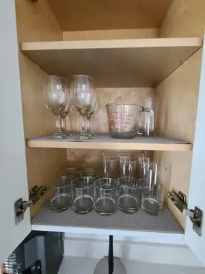 a cupboard with wine glasses and bowls on it at West Brickell - #3 - Renovated 2 1 & Parking in Miami