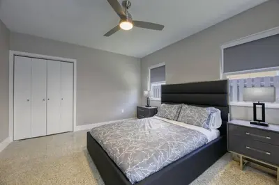 a bedroom with a bed and a ceiling fan at Sunshine Manor 2009 in Fort Lauderdale