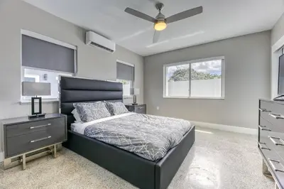 a bedroom with a bed and a ceiling fan at Sunshine Manor 2013 in Fort Lauderdale