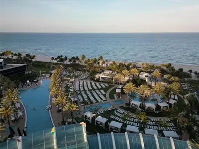 an aerial view of a resort near the ocean at FontaineBleau Resort Balcony w Ocean and City View in Miami Beach