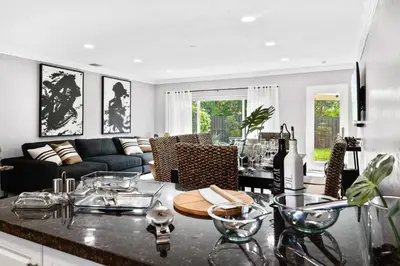 a living room with a couch and a table at Copacabana in Fort Lauderdale