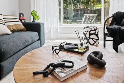 a living room with a coffee table with phones on it at Copacabana in Fort Lauderdale