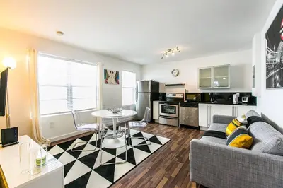 a living room with a couch and a table at 1 Bedroom 5 minutes walk to Beach on Washington Ave in Miami Beach