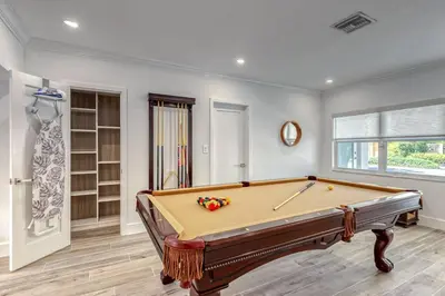 a billiard room with a pool table in a room at Mango Manor - Walk to Las Olas! in Fort Lauderdale