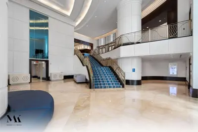 a spiral staircase in a building with blue steps at FontaineBleau Resort Balcony w Pool & Ocean View in Miami Beach