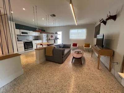 a living room with a couch and a table at Cozy house close Brickell in Miami