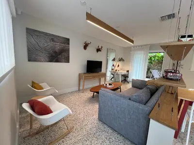 a living room with a couch and a table at Cozy house close Brickell in Miami