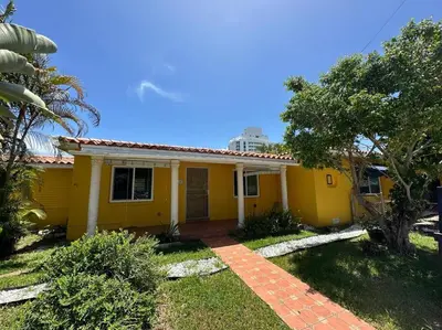a yellow house with a red roof at Stylish Studio Brickell/Little Havana@ItalianPlaza in Miami
