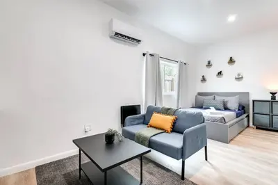 a living room with a couch and a bed at Coral Way Studio in quiet area Fast Internet Shen 1 in Miami