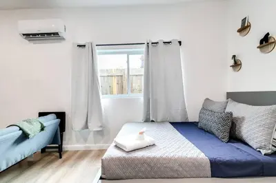 a bedroom with a bed and a window at Coral Way Studio in quiet area Fast Internet Shen 1 in Miami