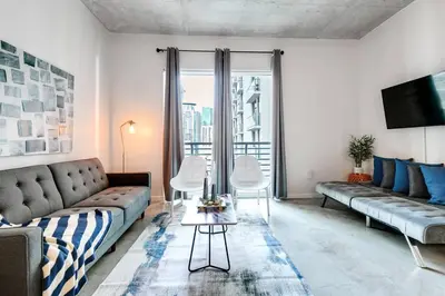 a living room with a couch and a table at Super convenient 1br apartment in Downtown 4 p 1708 in Miami