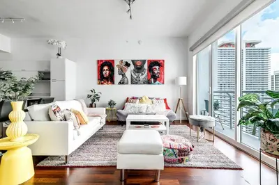 a living room with white furniture and large windows at Stylish 2br Apt in Downtown City View 3208 in Miami
