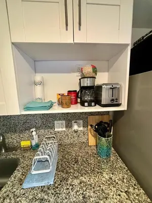 a kitchen counter top with a sink and a counter sidx sidx sidx at Nice 2 Twin bedroom - Best central location in Miami - Luggage storage, parking and Laundry for free!!!! in Miami