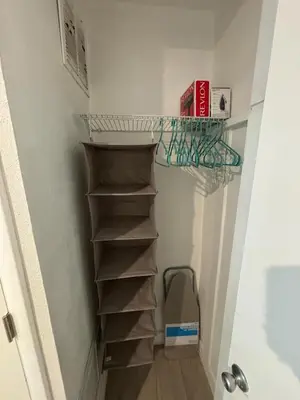 a walk in closet with a shelf and a box at Nice 2 Twin bedroom - Best central location in Miami - Luggage storage, parking and Laundry for free!!!! in Miami