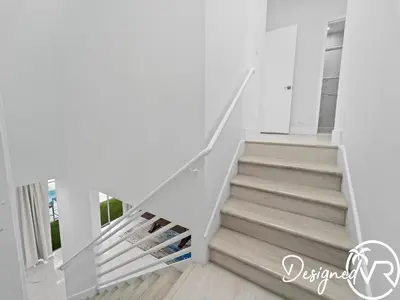 a staircase in a house with white walls and wooden floors at Villa wpool spa game room in Hollywood