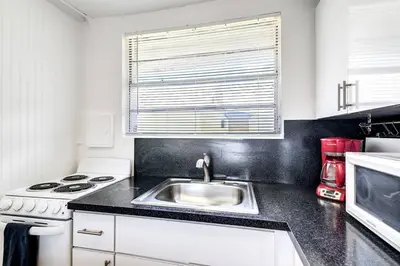 a kitchen with a sink and a stove at Inviting 1-BR apartment for 4 people V2 in Miami