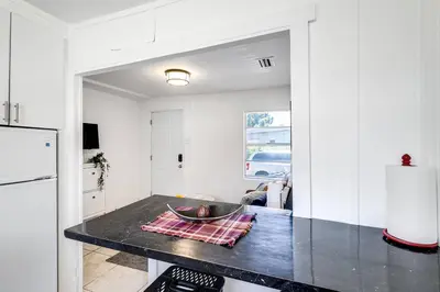 a kitchen with a black counter top in a room at Inviting 1-BR apartment for 4 people V2 in Miami