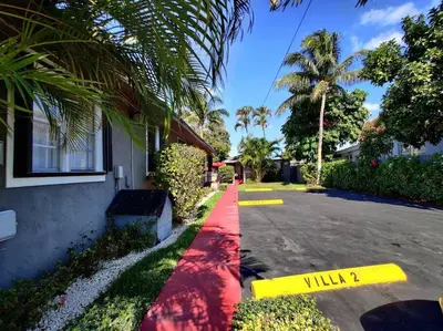 a street with a red curb next to a house at Wonderful Studio Cottage 2 people V5 in Miami
